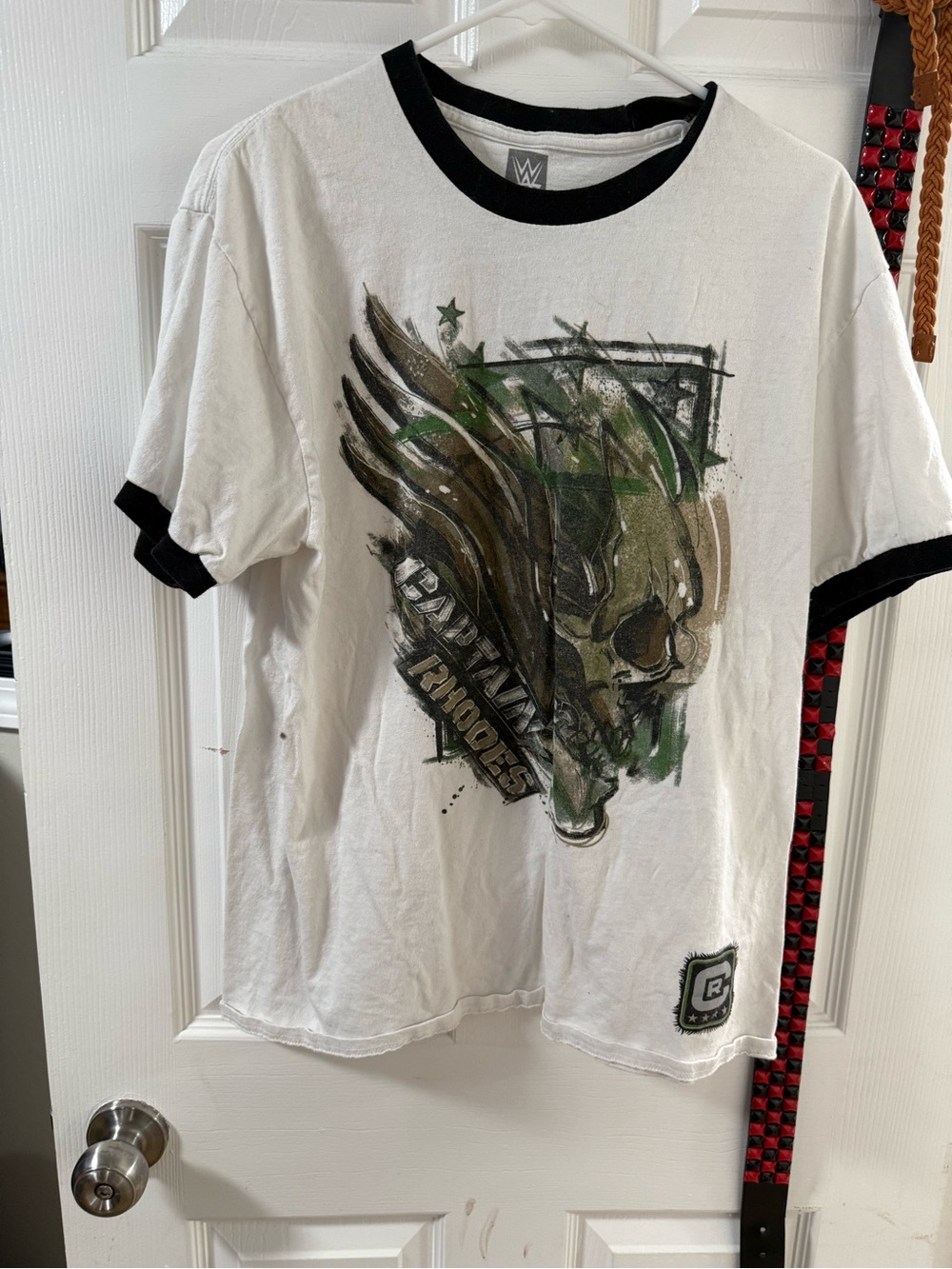 WWE White Ringer Tee with Black Trim and Green/Brown Graphic Cody Rhodes